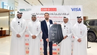 QIIB Chief of Human Resources and Administration, Ali Hamad Al-Mesaifri, and other officials presenting keys of three lexus vehicles to the winner.