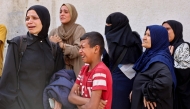 Women mourn relatives killed in an Israeli strike, at Al-Shifa hospital in Gaza City on May 26, 2025. (Photo by Omar Al-Qattaa / AFP)