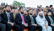 This handout picture shows Syria's interim president Ahmed Al Sharaa (2nd left) attending an event at the Aleppo Citadel on May 27, 2025. (Photo by SANA / AFP)