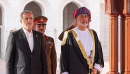 This handout picture provided by the Iranian presidential office shows Oman's Sultan Haitham bin Tariq al-Said (R) receiving Iran's President Masoud Pezeshkian (L) in Muscat on May 27, 2025. (Photo by Iranian Presidency / AFP)