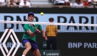 Italy's Jannik Sinner hits a volley to France's Richard Gasquet during their men's singles match on day 5 of the French Open tennis tournament on Court Philippe-Chatrier at the Roland-Garros Complex in Paris on May 29, 2025. (Photo by Alain JOCARD / AFP