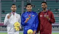 Qatar’s Abubaker Haydar Abdalla (right) poses with the other podium winners of men’s 800m.