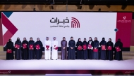 Minister of Education and Higher Education H E Lolwah bint Rashid bin Mohammed Al-Khater with graduating teachers of the “Khebrat” programme.