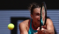 Belarus' Aryna Sabalenka plays a backhand return to China's Zheng Qinwen during their quarter-final women's singles match on day 10 of the French Open tennis tournament on Court Philippe-Chatrier at the Roland-Garros Complex in Paris on June 3, 2025. (Photo by Anne-Christine Poujoulat / AFP)