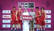 US Ambassador to Qatar H E Timmy Davis (fourth left) and QBF President Mohammed bin Saad Al Mughaiseeb with the victorious Qatar team. 