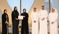 Minister of Social Development and Family HE Buthaina bint Ali Al Jabr Al Nuaimi (third left) with other officials at the event.