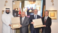 Director of the Abdullah bin Zaid Al Mahmoud Islamic Cultural Center Dr. Saleh bin Ali Al-Marri (left) receiving the prize.