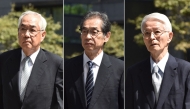 (FILES) This combination of pictures taken and created on September 19, 2019 shows three former executives from Tokyo Electric Power Company (TEPCO), former chairman Tsunehisa Katsumata (R), who died in October 2024, and former vice presidents Ichiro Takekuro (C) and Sakae Muto (L), arriving at the Tokyo District Court to attend their trial. (Photo by Kazuhiro NOGI / AFP)
