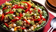 Roasted Red Pepper Salad With Mozzarella, Olives and Pesto. (Photo by Scott Suchman; food styling by Lisa Cherkasky/Both for The Washington Post)