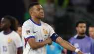 France's forward #10 Kylian Mbappe (C) and his teammates react after the UEFA Nations League semi-final football match between Spain and France in Stuttgart, southwestern Germany, on June 5, 2025. (Photo by Franck Fife / AFP) /