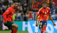 This combination of pictures created on June 06, 2025 shows Portugal's forward #07 Cristiano Ronaldo (L) controling the ball during the UEFA Nations League semi-final football match between Germany and Portugal in Munich, southern Germany on June 4, 2025 and Spain's forward #19 Lamine Yamal passing the ball during the UEFA Euro 2024 semi-final football match between Spain and France at the Munich Football Arena in Munich on July 9, 2024. (Photo by Tobias SCHWARZ and Fabrice COFFRINI / AFP)