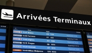 This photograph shows a board listing arriving flights at Roissy-Charles de Gaulle Airport north-east of Paris on June 10, 2025, as Swedish campaigner Greta Thunberg left Israel on a flight to Sweden via France, after she was detained along with other activists aboard a Gaza-bound aid boat. (Photo by Hugo Mathy / AFP)