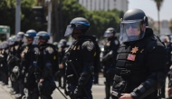 Police officers in riot gear stage outside of the Metropolitan Detention Center on June 9, 2025 in Downtown Los Angeles, California. Jim Vondruska/Getty Images/AFP 