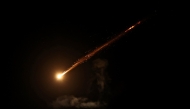 This picture shows a trail from an Iranian rocket in the sky above Jerusalem on June 13, 2025. (Photo by AHMAD GHARABLI / AFP)
