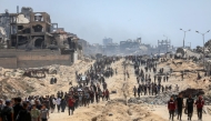 Palestinians are seen in the Sudaniya area, northern Gaza City, on June 12, 2025. (Photo by Rizek Abdeljawad/Xinhua)
