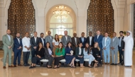 Hilton Salwa Beach Resort & Villas team with an award.