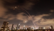 Israeli air defence systems are activated to intercept Iranian missiles over Tel Aviv early on June 18, 2025. (Photo by Menahem Kahana / AFP)
