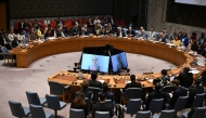 Director General of the International Atomic Energy Agency (IAEA) Rafael Grossi, is seen on a TV screen as he speaks during a United Nations Security Council meeting on the Israel-Iran conflict at the UN headquarters in New York on June 20, 2025. Photo by ANGELA WEISS / AFP.