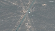 Handout satellite image courtesy of Maxar Technologies shows new vehicle revetments and trucks on road 1.1 km (0.6 miles) from Iran's Fordow Fuel Enrichment Plant (FFEP), in Fordo, Iran on June 20, 2025. (Photo by Satellite image 2025 Maxar Technologies / AFP) 