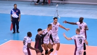 Qatar players celebrate a point against Vietnam.