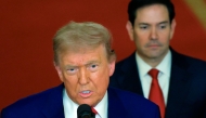US President Donald Trump addresses the nation, alongside US Secretary of State Marco Rubio (R) from the White House in Washington, DC on June 21, 2025. (Photo by Carlos Barria / POOL / AFP)
