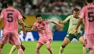 Inter Miami's Argentine forward #10 Lionel Messi (C) fights for the ball with Palmeiras' Brazilian midfielder #30 Lucas Evangelista (2nd L) and Palmeiras' Brazilian defender #03 Bruno Fuchs (2nd R) during the FIFA Club World Cup 2025 Group A football match between US Inter Miami and Brazil's Palmeiras at the Hard Rock stadium in Miami on June 23, 2025. (Photo by CHANDAN KHANNA / AFP)