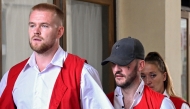 British nationals (L-R) Phineas Ambrose Float, Jonathan Christopher Collyer and Lisa Ellen Stocker are brought to court for their trial in Denpasar, Indonesia's Bali island on June 24, 2025. Photo by SONNY TUMBELAKA / AFP