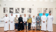 Speakers and officials in a group photo at the event.