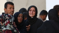 Palestinians mourn outside Al-Shifa hospital in Gaza City, on June 26, 2025, after several people were killed during overnight Israeli strikes. Photo by Omar AL-QATTAA / AFP