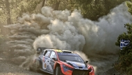 Estonia's Ott Tanak and his co-driver Martin Jarveoja driver their Hyundai i20 N Rally1 at the special stage Agioi Theodoroi during the Acropolis Rally in Agioi Theodoroi on June 27, 2025. (Photo by Valerie GACHE / AFP)