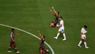  Ignacio #4, Thiago Silva #3 and Thiago Santos #29 of Fluminense FC celebrate in front of Abderrazzaq Hamed Allah #10 and Marcos Leonardo #11 of Al Hilal following the FIFA Club World Cup 2025 quarter final match between Fluminense FC and Al Hilal at Camping World Stadium on July 04, 2025 in Orlando, Florida. (Photo by Michael Reaves / GETTY IMAGES NORTH AMERICA / Getty Images via AFP)