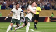 Chelsea's English midfielder #10 Cole Palmer (R) celebrates with teammate Argentinian midfielder #08 Enzo Fernandez (L) after scoring his team's first goal during the FIFA Club World Cup 2025 quarterfinal football match between Brazil's Palmeiras and England's Chelsea at the Lincoln Financial Field Stadium in Philadelphia on July 4, 2025. (Photo by FRANCK FIFE / AFP)