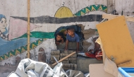 Children check the destruction at Mustafa Hafez school, sheltering Palestinians displaced by the war, after the school was hit during an overnight Israeli strike in Gaza City, on July 3, 2025. Photo by Omar AL-QATTAA / AFP