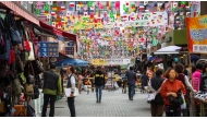 Seoul is a global shopping hub with areas like Myeongdong, famous for its trendy fashion boutiques, beauty stores, and street food. 