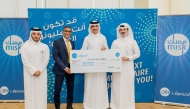 The winner receiving the prize from the officials.