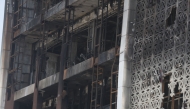 A close up shot shows on July 17, 2025 the damaged facade after a fire tore through the newly opened Hyper Mall overnight in the eastern Iraqi city of Kut, killing at least 60 people, according to Iraqi authorities. Photo by AHMAD AL-RUBAYE / AFP