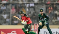 Bangladesh's Towhid Hridoy (L) plays a shot during the first Twenty20 international cricket match between Bangladesh and Pakistan at the Sher-e-Bangla National Cricket Stadium in Dhaka on July 20, 2025. (Photo by MUNIR UZ ZAMAN / AFP)