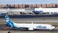 A Boeing 737-900er passengers aircraft of Alaska Airlines on its way to San Francisco is seen before take-off at John F. Kennedy Airport on January 8, 2024. Photo by Charly TRIBALLEAU / AFP