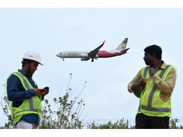 An Air India Express aircraft prepares to land at Kempegowda International Airport in Bengaluru on September 4, 2024. (Photo by Idrees MOHAMMED / AFP)