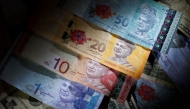 File photo of several Malaysian ringgit notes for representational purposes only. Reuters.