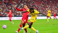 Rafael Leao (front R) of AC Milan competes during the match between Liverpool and AC Milan of the Hong Kong Football Festival in Hong Kong, south China, July 26, 2025. (Xinhua/Zhu Wei)
