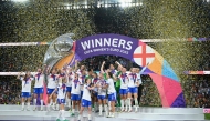 England's players lift the trophy as they celebrate winning the UEFA Women's Euro 2025 final football match between England and Spain at the St. Jakob-Park Stadium in Basel, on July 27, 2025. (Photo by SEBASTIEN BOZON / AFP)
