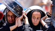 Palestinians wait at a lentil soup distribution point in Gaza City in the northern Gaza Strip on July 27, 2025. (Photo by Omar AL-QATTAA / AFP)
