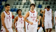 Qatar’s reserve team players celebrate during the match. 