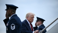 US President Donald Trump boards Air Force One at Joint Base Andrews, Maryland, on August 1, 2025. Trump is travelling to New Jersey to spend the weekend at his Bedminster residence. (Photo by Brendan SMIALOWSKI / AFP)

