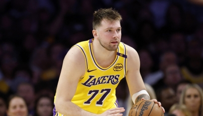 Luka Doncic #77 of the Los Angeles Lakers dribbles during a 103-96 loss to the Minnesota Timberwolves in Game Five of the Western Conference First Round NBA Playoffs at Crypto.com Arena on April 30, 2025 in Los Angeles, California. (Photo by Harry How / GETTY IMAGES NORTH AMERICA / AFP)
