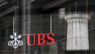 A sign and logo of the Swiss giant banking UBS is seen in Lausanne on February 6, 2024. Photo by Fabrice COFFRINI / AFP