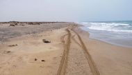 Body lies on the beach in Yemen's Abyan province. AFP file photo.