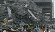 File photo of rescue teams at a construction site where a building collapsed in Bangkok on March 28, 2025, after an earthquake. Photo by Lillian Suwanrumpha / AFP

