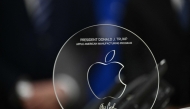 A memento presented by Apple CEO Tim Cook is seen on the Resolute Desk in the Oval Office of the White House in Washington, DC, on August 6, 2025 before announcing that Apple will invest an additional $100 billion in the United States, taking its total pledge to $600 billion over the next four years. (Photo by Brendan SMIALOWSKI / AFP)